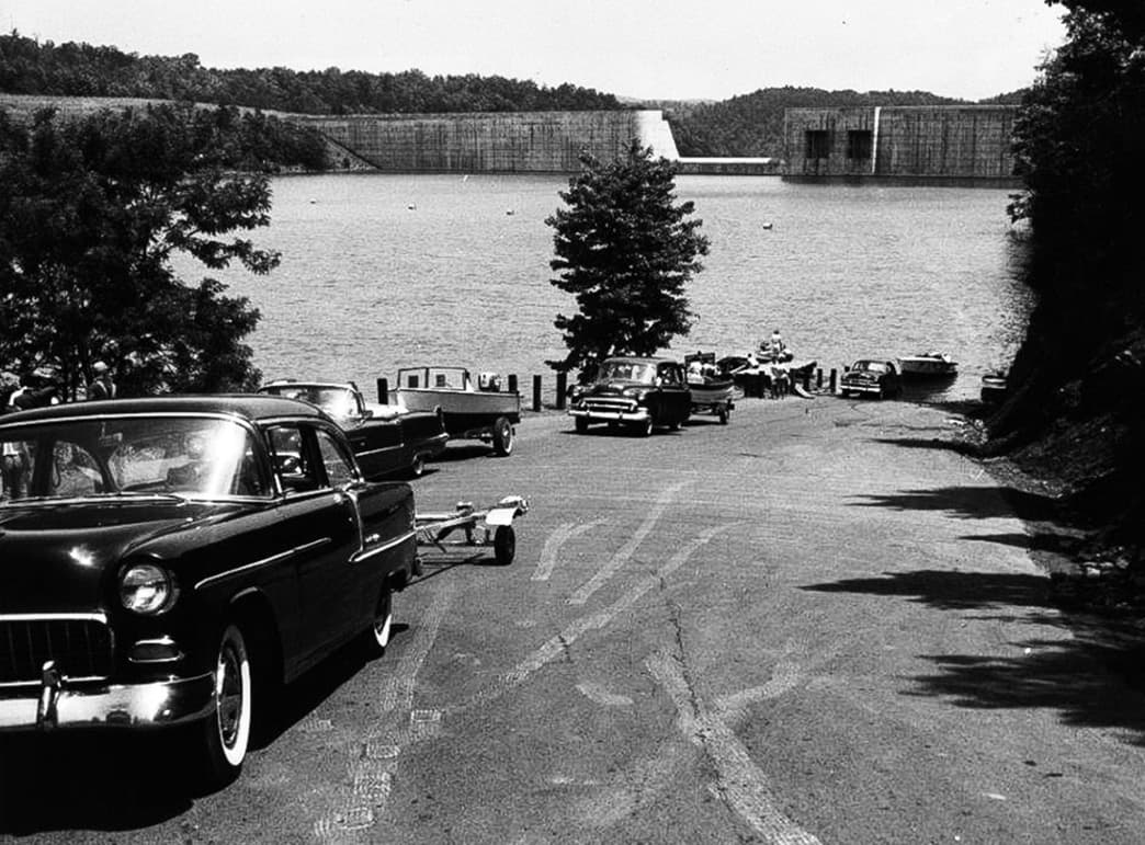 Black and white photo of cars on a road by Philpott Lake